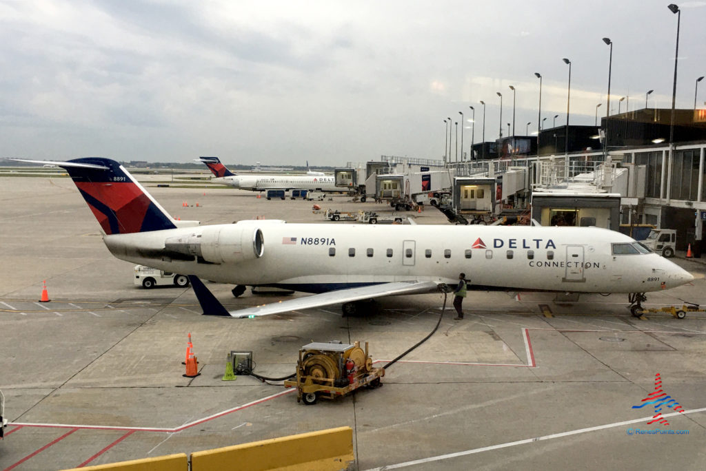 An Endeavor Air CRJ-200 (tail number N8891A) operating as a Delta Connection flight is seen from the Delta Sky Club at Chicago O'Hare International Airport (ORD).