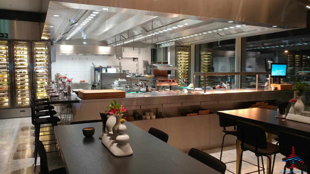 a kitchen with a large counter and a large window