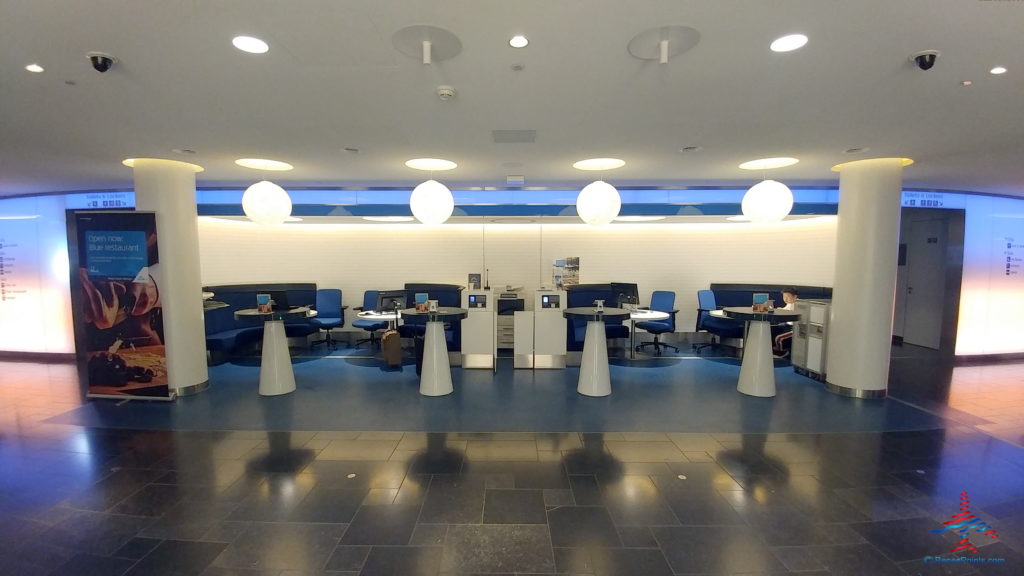 a room with blue chairs and blue tables