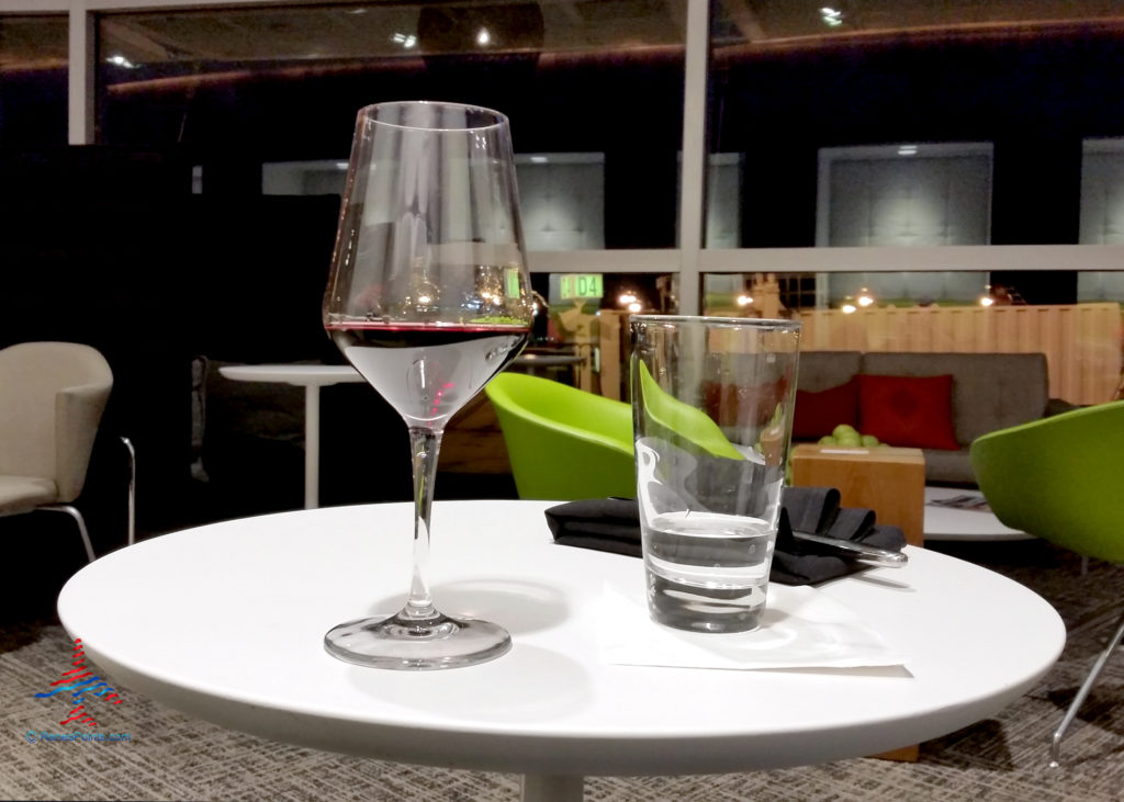 A glass of Malbec red wine and a glass of water are seen at the entrance to the American Express Centurion Lounge at McCarran International Airport (LAS) in Las Vegas, Nevada.