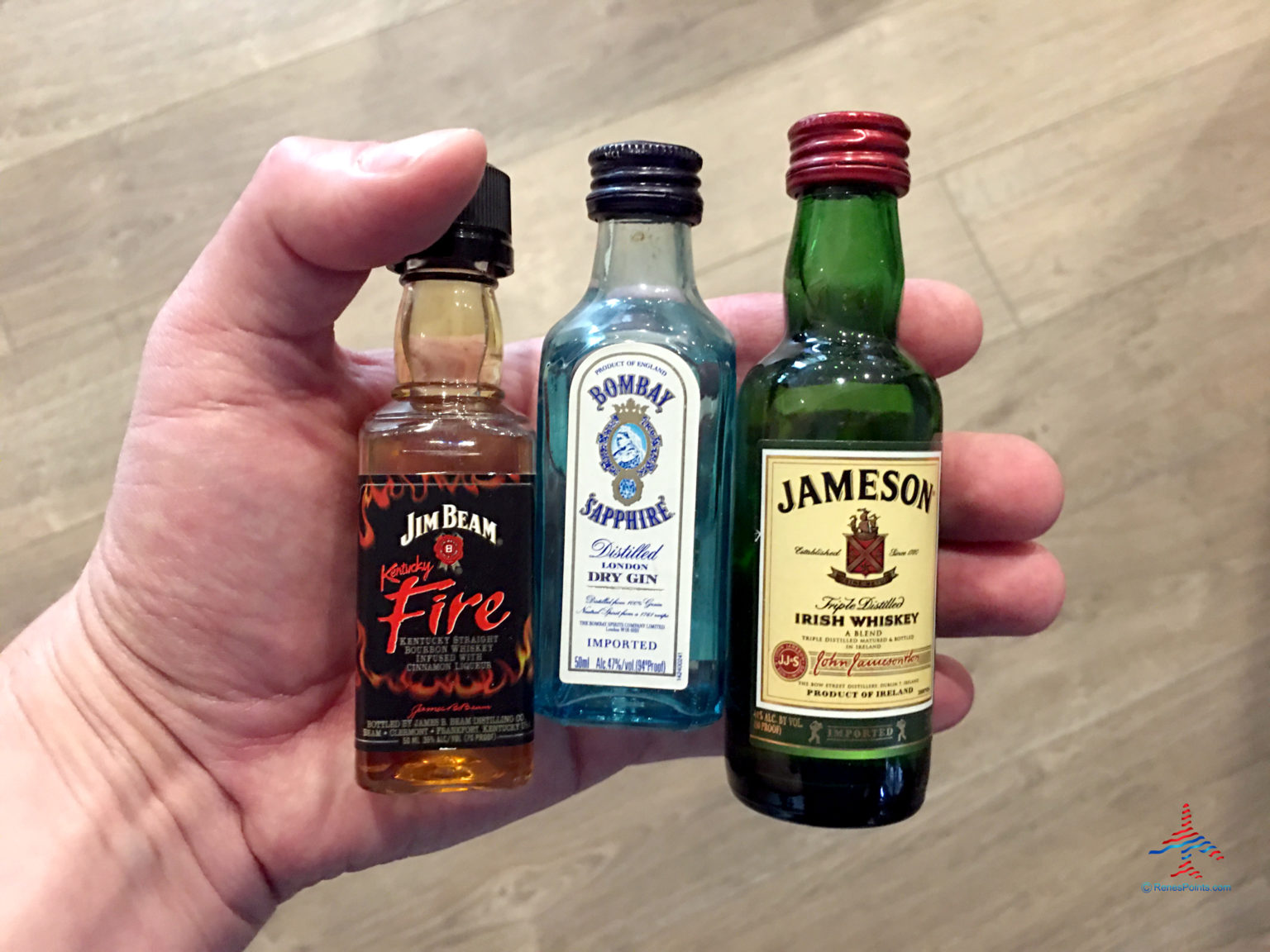 mini-liquor-bottles-in-hand-before-flight-eye-of-the-flyer