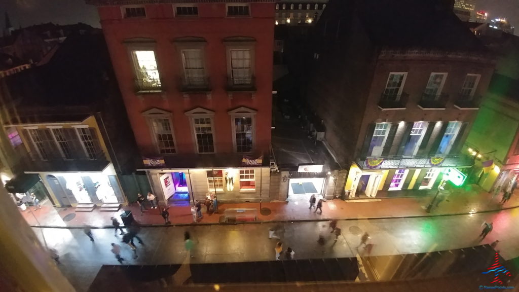 a group of people walking on a sidewalk