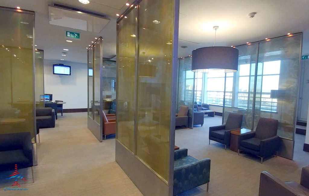 a room with glass walls and chairs