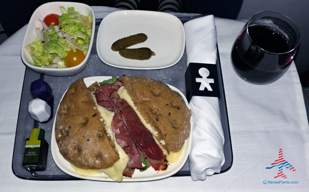 a sandwich and salad on a tray