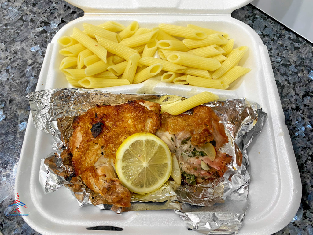 Chicken piccata and pasta from a food delivery.