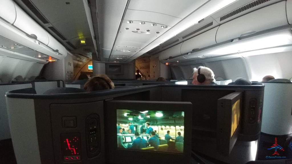 a group of people sitting in an airplane