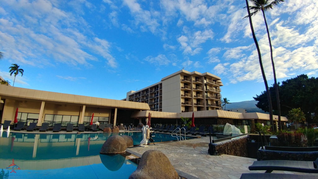 a pool with a building in the background