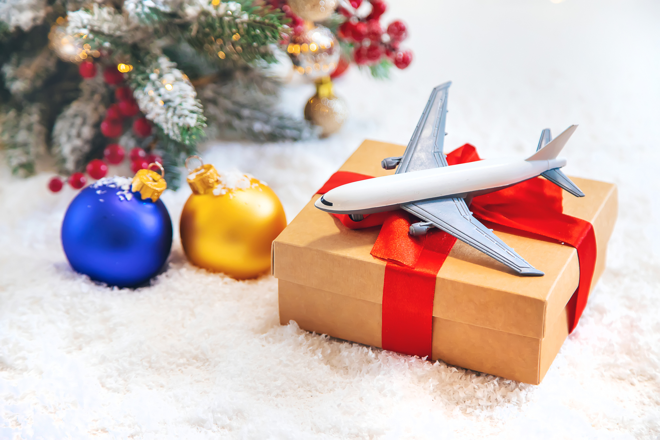 Christmas background with airplane. Travel concept for the holidays