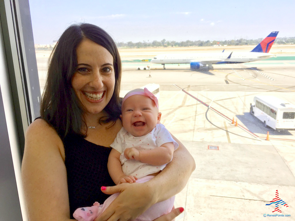 a woman holding a baby