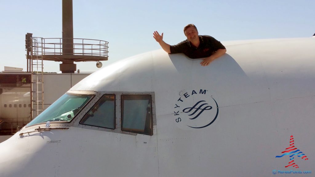 a man leaning on a plane