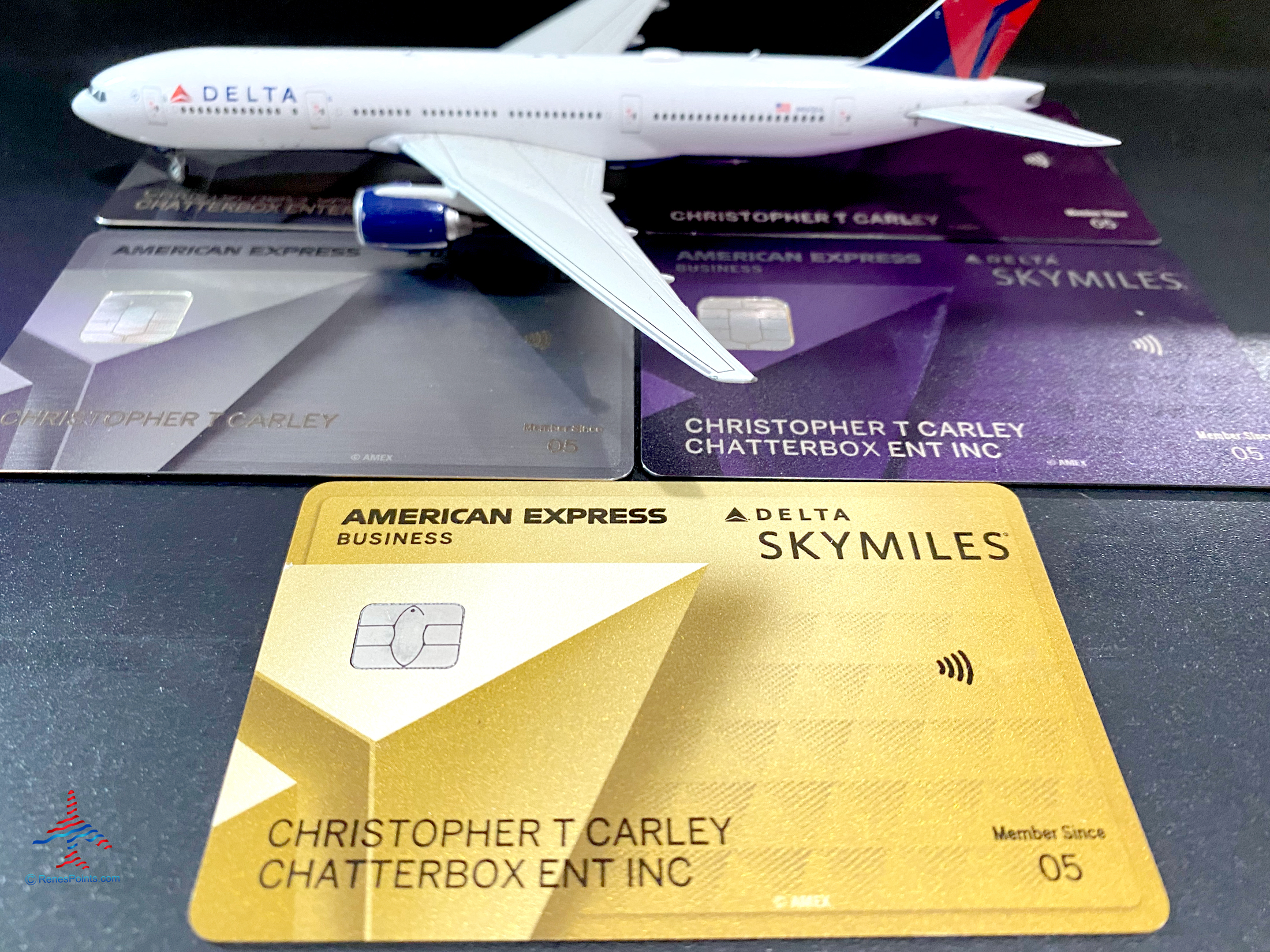 Delta SkyMiles American Express cards with a miniature 777.
