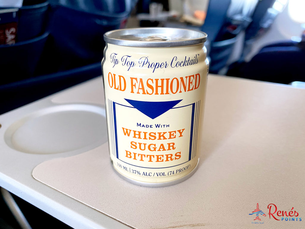 A can of Tip Top Proper Cocktails' Old Fashioned is seen on a tray table in the first class cabin of a Delta Air Lines 757-200 during a flight from Los Angeles (LAX) to Salt Lake City (SLC).