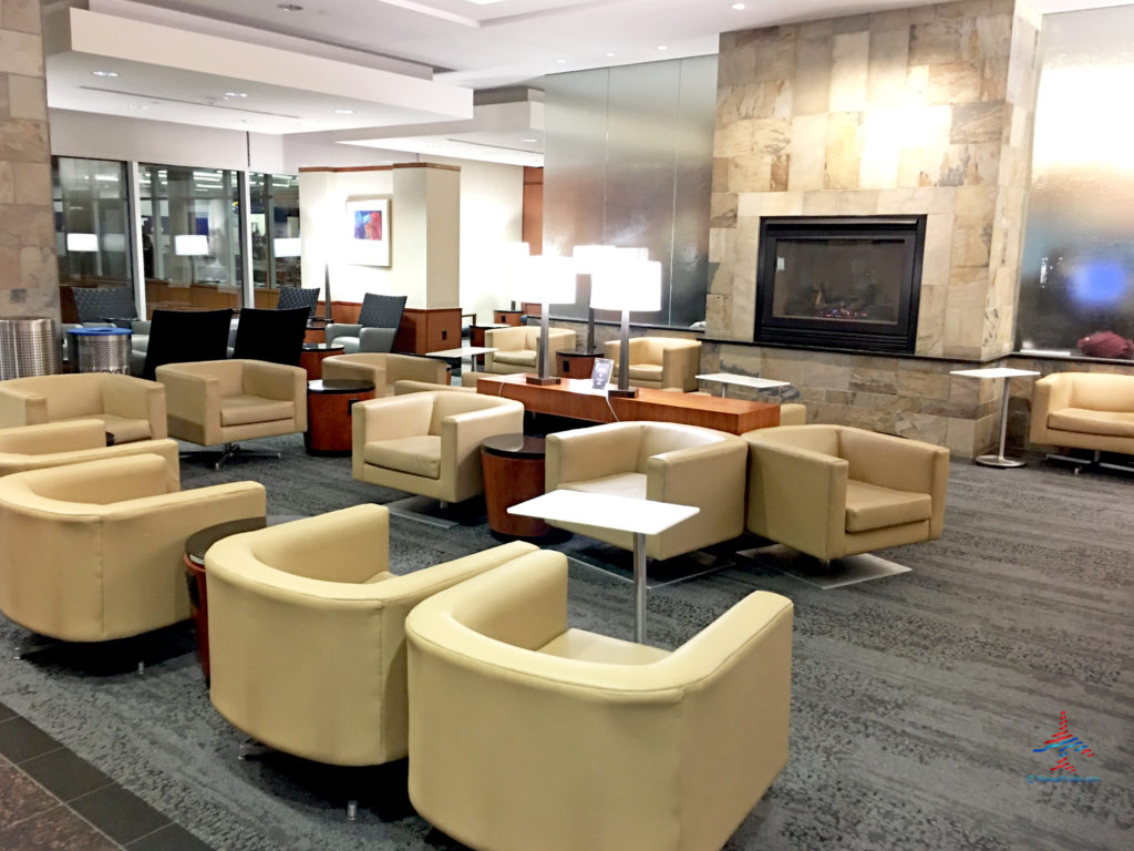 A view of the fireplace and adjacent seating area inside the Delta Sky Club on the C Concourse at Minneapolis-St. Paul International Airport (MSP)