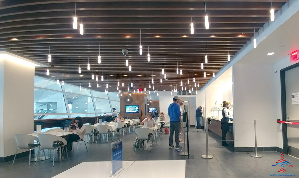 people sitting at tables in a restaurant