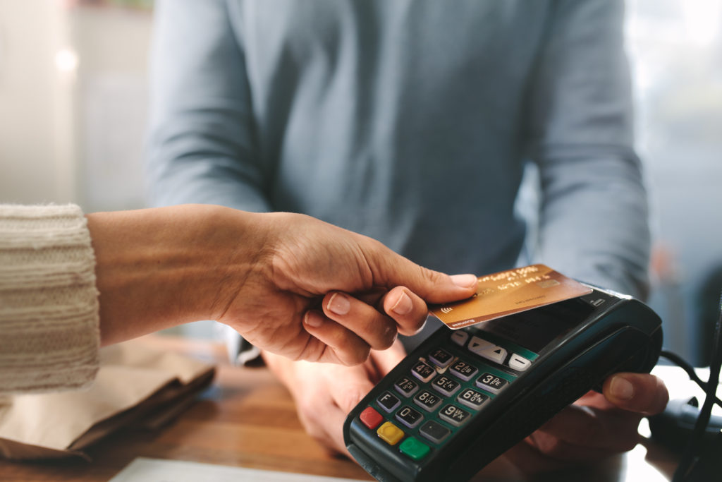 a person holding a credit card