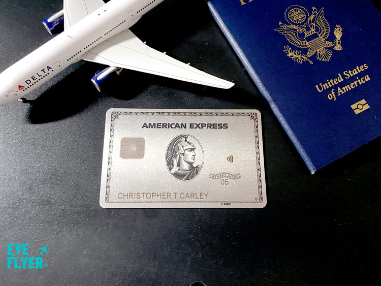 Delta Air Lines plane and a passport flank a Platinum Card® from American Express -- a product which earns Membership Rewards points.