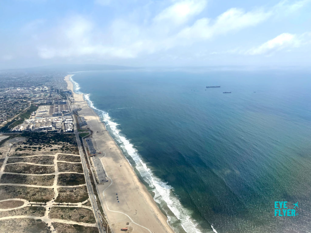 Dockweiler State Beach and El Segundo as seen after taking off from Los Angeles International Airport (LAX) near the Pacific Ocean in California.