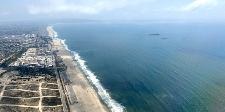 Dockweiler State Beach and El Segundo as seen after taking off from Los Angeles International Airport (LAX) near the Pacific Ocean in California.