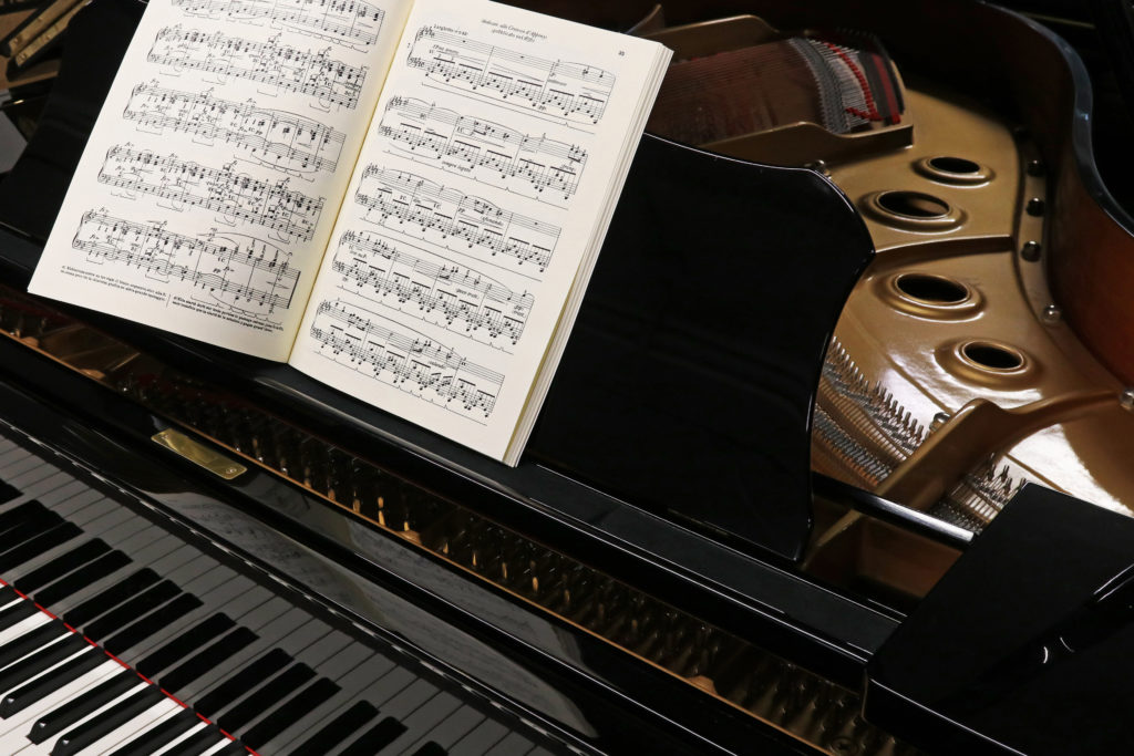 Grand piano for classical music with musical score