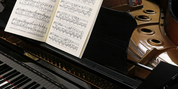 Grand piano for classical music with musical score