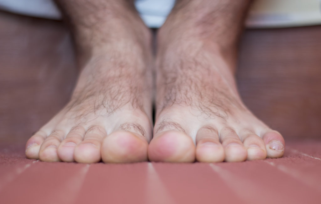 A hairy bare foot