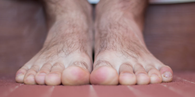 A hairy bare foot