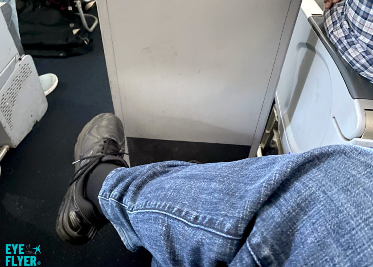 A passenger crosses his legs while sitting in seat 14D inside a Delta Air Lines A321. The seat is available in Delta’s Comfort+ service class.