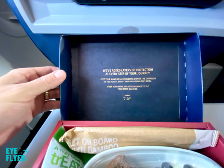 A review of the Delta Air Lines banana bread breakfast box served in first class during a flight.