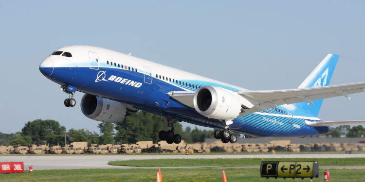 "Oshkosh, WI, USA - July 29, 2011: Brand new Boeing 787 Dreamliner in factory paint scheme taking off during EAA Airventure 2011."