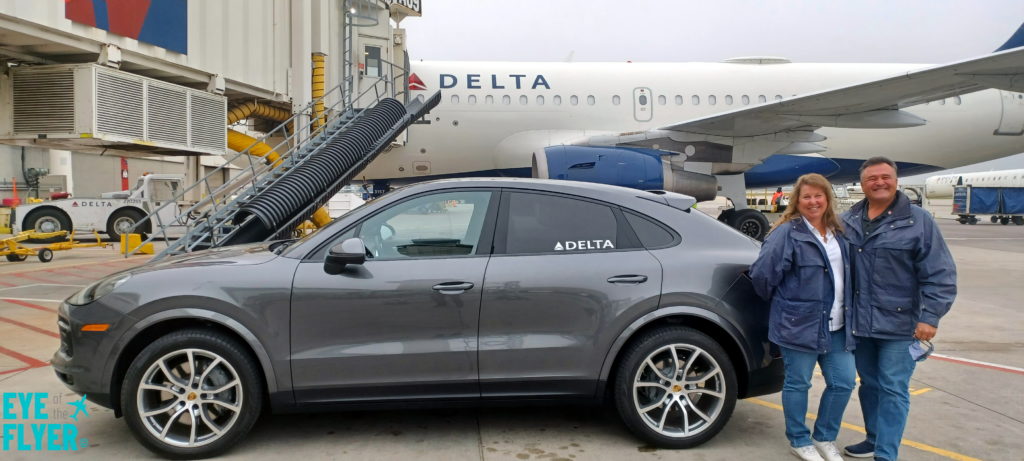 a car parked next to a plane