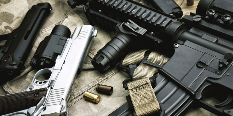 Weapons and military equipment for army, Assault rifle gun (M4A1) and pistol on camouflage background.