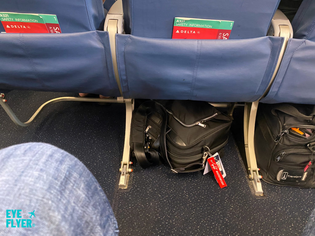 a luggage under a seat