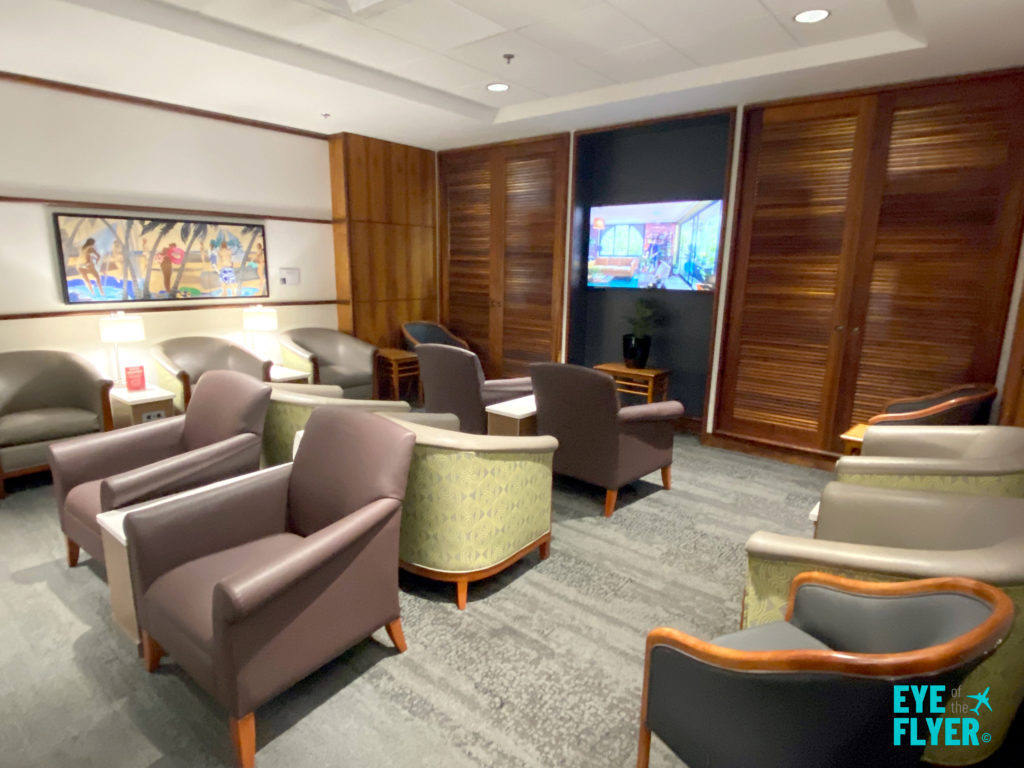 TV area in the Delta Sky Club Honolulu airport lounge.