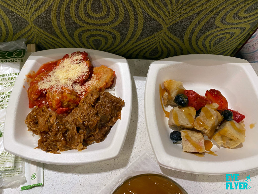 Meatballs, pulled pork, and bread pudding at the Delta Sky Club Honolulu