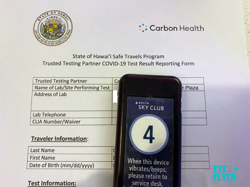 A Carbon Health negative COVID test in a Delta Sky Club.