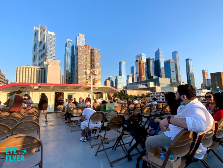 Upper deck of a Circle Line Harbor Lights Cruise around New York City during sunset and starlight.