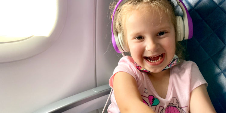 A young child sits in first class on a Delta Air Lines marketed flight.