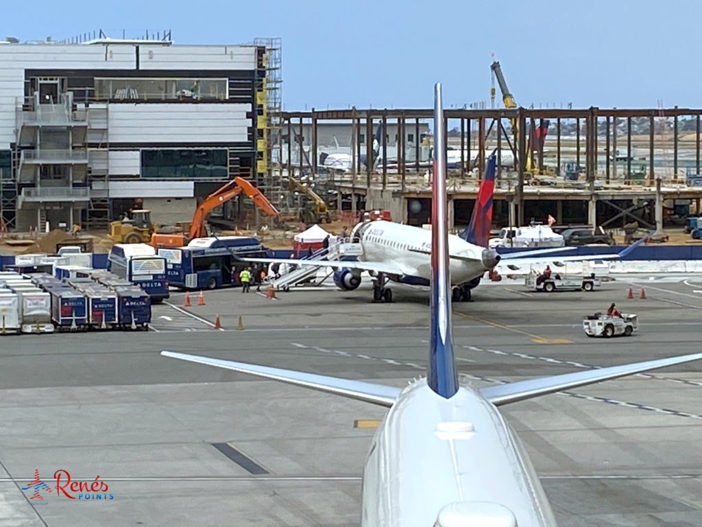 Passengers board air stairs at a hard stand for a Delta Air Lines flight at Los Angeles International Airport (LAX).