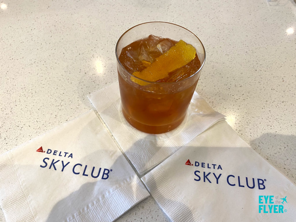 A Peanut Butter Old Fashioned is displayed inside the Newark (EWR) Delta Sky Club.