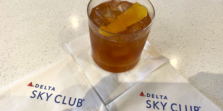 A Peanut Butter Old Fashioned is displayed inside the Newark (EWR) Delta Sky Club.