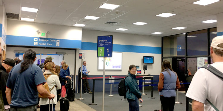 Passengers wait to board a Delta Air Lines flight at Gate B1 inside Terminal B at Hollywood Burbank Airport (BUR) in Burbank, California.