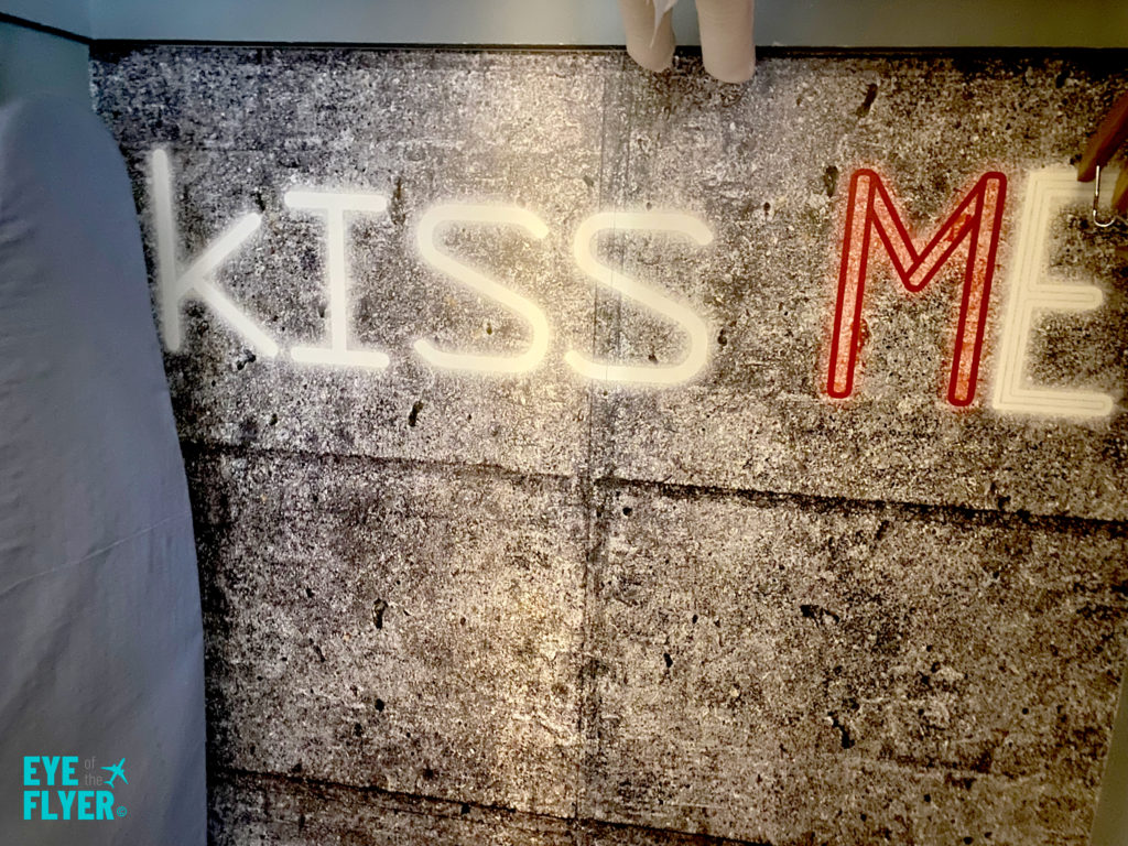 "Kiss Me" artwork painted on a closet wall inside a King Premier Room at the Kimpton Muse Hotel near Times Square in New York