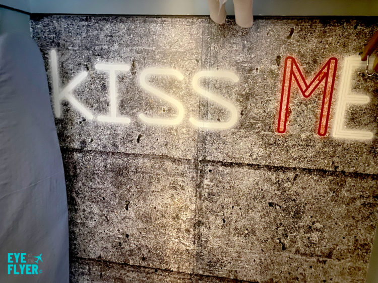 "Kiss Me" artwork painted on a closet wall inside a King Premier Room at the Kimpton Muse Hotel near Times Square in New York