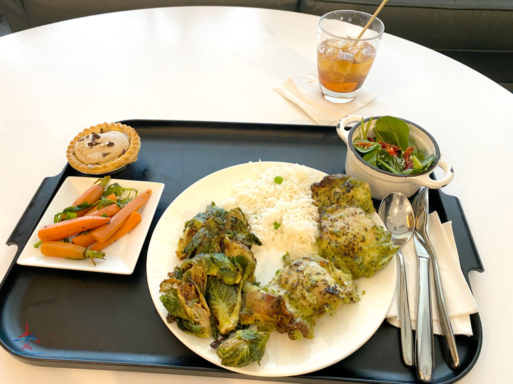 A tray of food and an Old Fashioned are seen on the buffet inside the dining area during a visit to American Express’ The Centurion Lounge - Las Vegas airport club lounge at Las Vegas International Airport (LAS) in Las Vegas, Nevada.