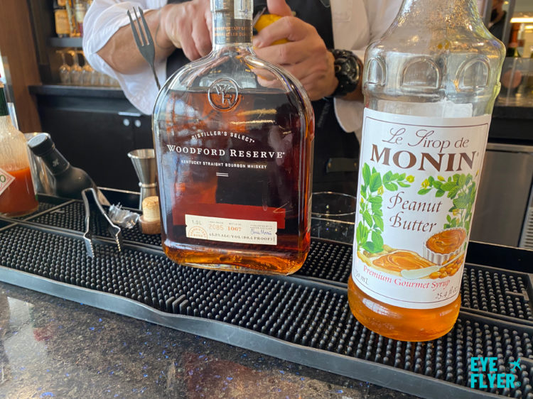 Peanut Butter Old Fashioned ingredients are displayed inside the Newark (EWR) Delta Sky Club.