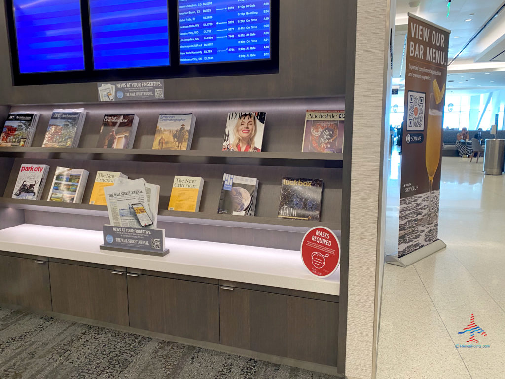 Periodicals are displayed during a visit to the Delta Sky Club Salt Lake City inside Terminal A of Salt Lake City International Airport (SLC). (Photo ©RenesPoints.com)