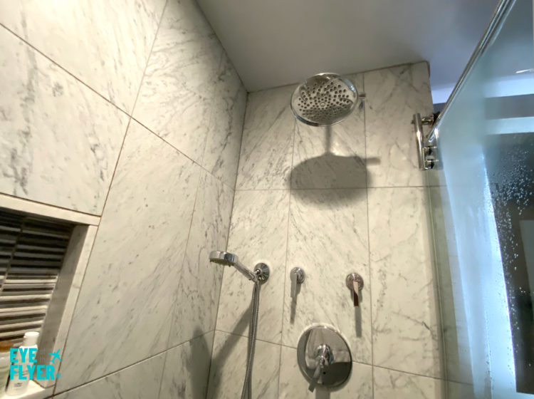 Shower in bathroom inside a King Premier Room at the Kimpton Muse Hotel near Times Square in New York