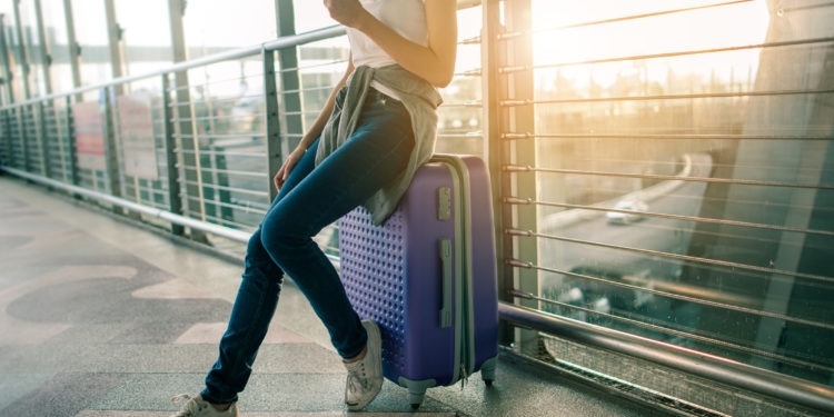 Leisure traveler with suitcase