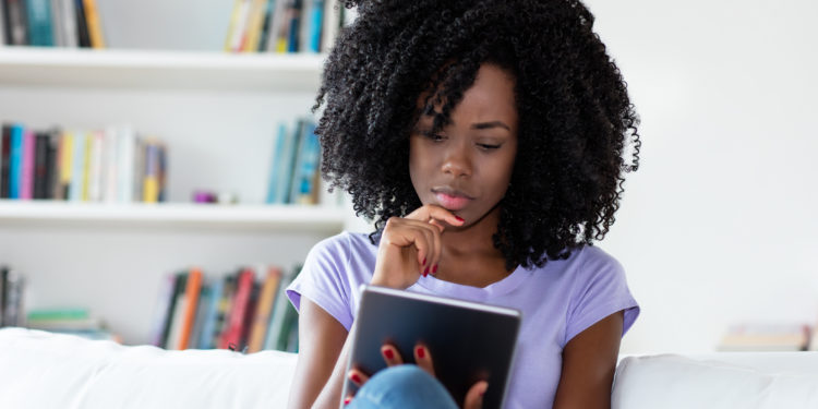 Woman reading a blog post on a tablet