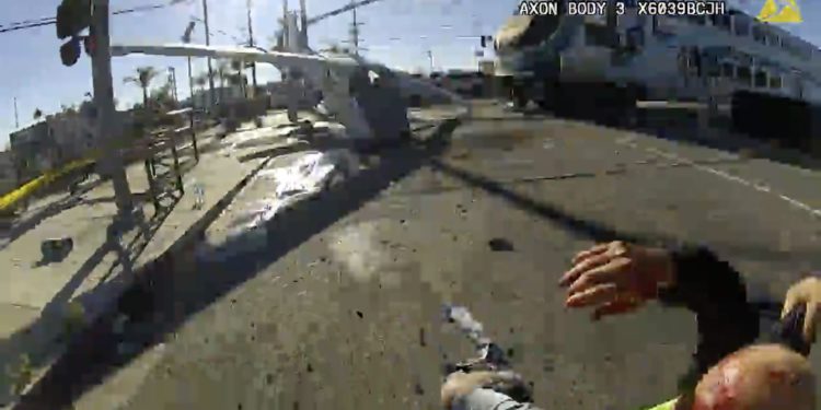 LAPD rescues a man from a plane before a train runs over it.